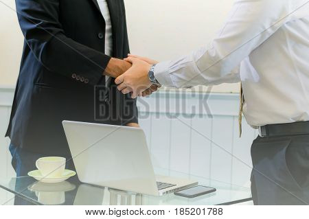 Businessman shaking hand success agreement business contract.