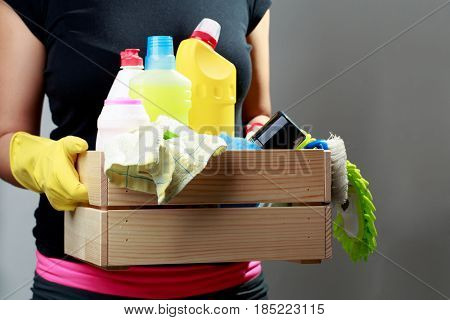 Girl in gloves with box