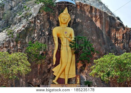 Golden stone statue of a Buddha in Thailand.
