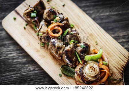grilled fresh portuguese chourico chorizo sausage starter tapas snack set on wood board