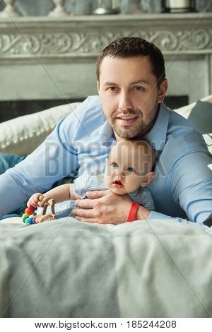 Happy dad with a little daughter of European appearance