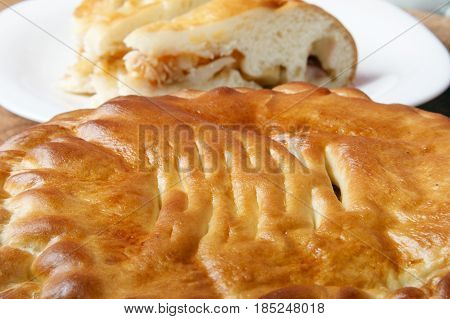 Fresh homemade fruit cake on a wooden background