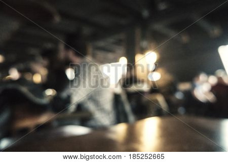 Coffee shop blur background with bokeh effect and vintage color tone