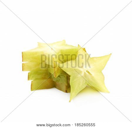 Pile of sliced carambola starfruit fruits isolated over the white background