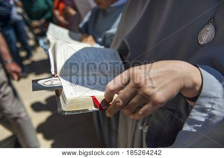 Fatima Portugal - May 13 2014: Nun reading the bible at the Sanctuary of Fatima during the celebrations of the apparition of the Virgin Mary in Fatima Portugal.