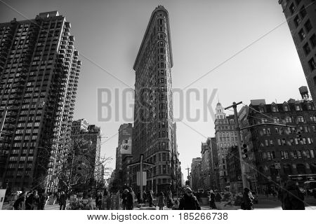 NEW YORK, USA - MARCH 24, 2017: The Flatiron Building is a triangular 22-story steel-framed landmarked building in the borough of Manhattan, New York, is considered to be a groundbreaking skyscraper.