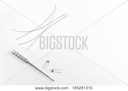 Spare Wire, Two Coil Jig And Micro Coil Isolated On White Background. Copyspace