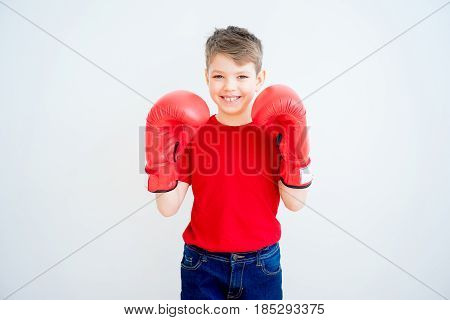 Kid with boxing gloves isolated on white background