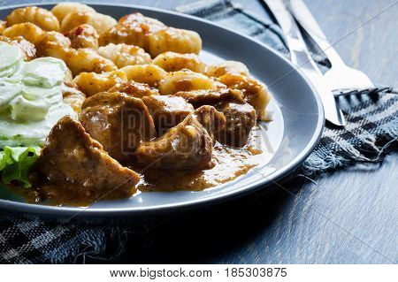 Italian Potato Dumplings With Stew And Cucumber Salad