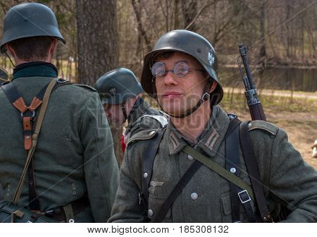 Gatchina Russia - May 7 2017: Historical reconstruction of the battles of World War II. A participant in the reconstruction in the form of a Wehrmacht soldier before the start of the battle.