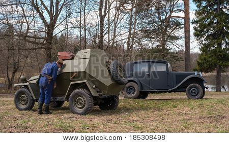Gatchina, Russia - May 7, 2017: Historical reconstruction of the battles of World War II. Soviet armored car and passenger car Mercedes Benz.