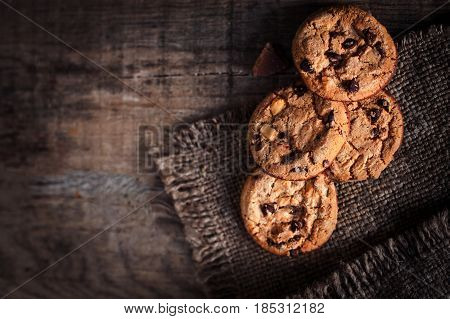 Homemade Chocolate chip cookies freshly baked on rustic wooden table. Selective Focus. Copy space.