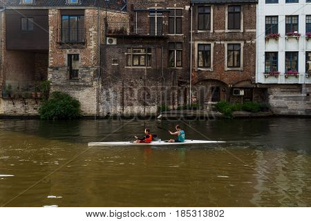 Tourist Kayaking In Ghent Canal