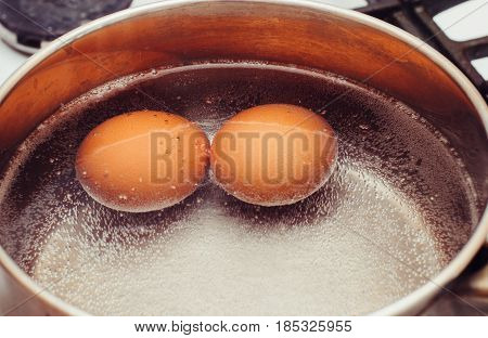 Eggs are cooked on the gas stove.