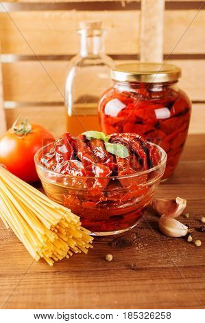 Italian Spaghetti With Ingredients For Cooking Pasta On A Wooden Table