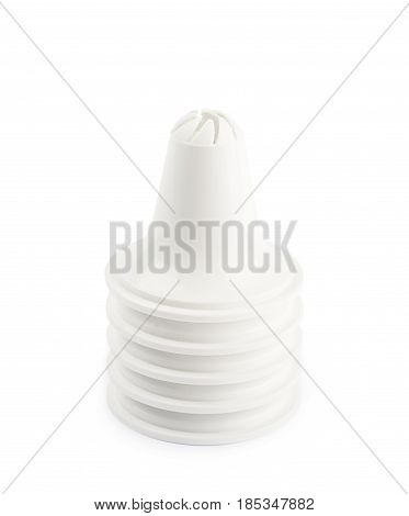 Decorational cream piping bag's plastic tip isolated over the white background