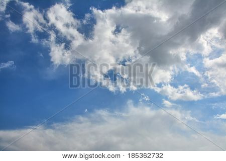 Clouds over blue sky. Spring rainy day