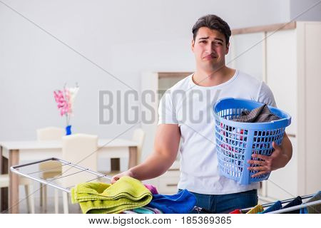 Man doing laundry at home