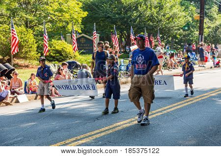 DUNWOODY GEORGIA - July 4 2016: Participants and spectators in the annual Dunwoody Georgia 4th of July parade which attracts over 2500 participants and 32000 spectators