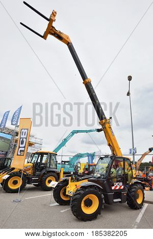 VILNIUS LITHUANIA - APRIL 27: JCB heavy duty equipment vehicle and logo on April 27 2017 in Vilnius Lithuania. JCB corporation is manufacturing equipment for construction and agriculture.