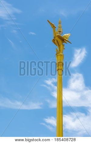 Thai style golden swan statue on golden pillar of public temple in Thailand
