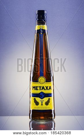 Metaxa on gradient background. Metaxa is Greek spirit based on brandy blended with muscat wine and natural flavorings. It is exported to over 65 countries.