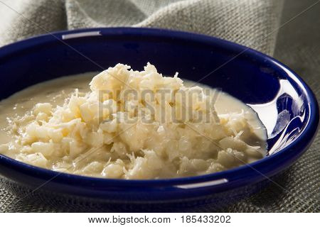 Brazilian Dessert Canjica Our Mungunza Of White Corn In Blue Bowl