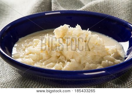 Brazilian Dessert Canjica Our Mungunza Of White Corn In Blue Bowl