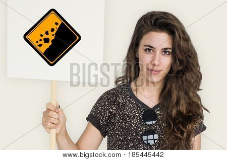 Studio Shoot Holding Banner with Rockfall Beware Sign 