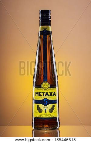 Metaxa on gradient background. Metaxa is Greek spirit based on brandy blended with muscat wine and natural flavorings. It is exported to over 65 countries.
