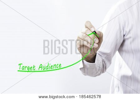 Businessman draw growing line symbolize growing target audience.