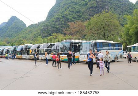 YANGSHOU CHINA - NOVEMBER 19, 2016: Unidentified people visit travel by tour bus in Xingping.