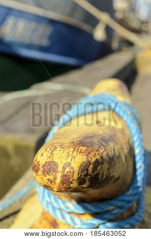 Mooring cleat and line on New England wharf