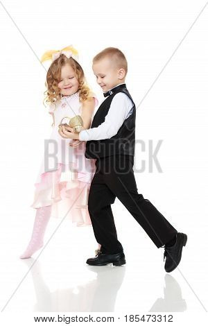 The little boy keeps at arm's length in front of her slipper.Isolated on white background.