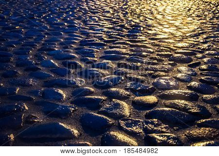 Pavement paved with stones. An ancient road.