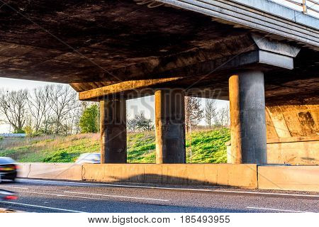 Empty UK Motorway under junction bridge evening.