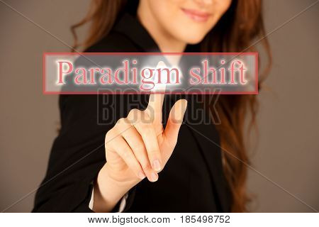 Attractive business woman pressing a virtual button paradigm shift