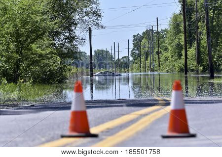Stranded Car On A Flooded Road