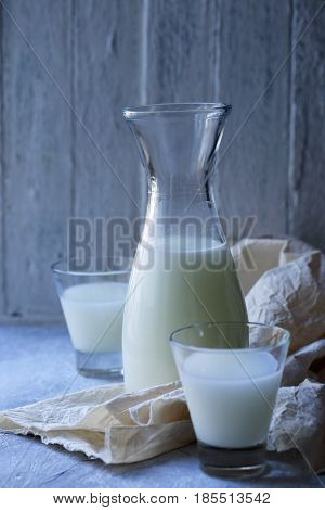 Homemade serum in a Pitcher in rustic style