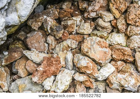Pile of red and whte stones in a forest Polish jurrasic.