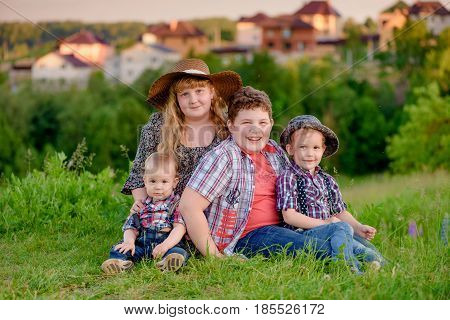 funny sibling on the background of the village