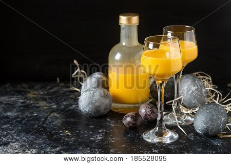 Traditional Italian Yellow Egg Liquor, Bombardino. Dark Backgrou