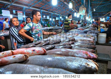 Bandar Abbas Hormozgan Province Iran - 15 april 2017: Muslim buyers choose fresh fish in the indoor fish market.