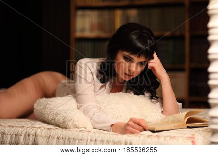 Rest, Comfort, Leisure - Sexy Young Woman Reading Book In Bed At Home Bedroom. Naked Legs Ass And Wh