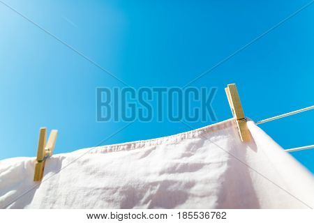 Bed Sheet Drying On A Rope Outside