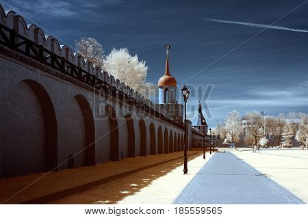 The landscape is shot on a specially installed camera on which a filter is installed that does not allow the visible range of light to be visible. But only infrared radiation. With this shooting the grass and foliage of the trees in white pink or red colo