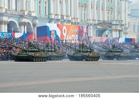 SAINT PETERSBURG, RUSSIA - MAY 07, 2017: Column of Soviet tanks T-72B3 in the Palace square. Dress rehearsal of parade in honor of Victory Day