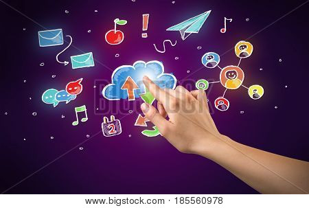 Female hand toucing mixed media icons with purple background