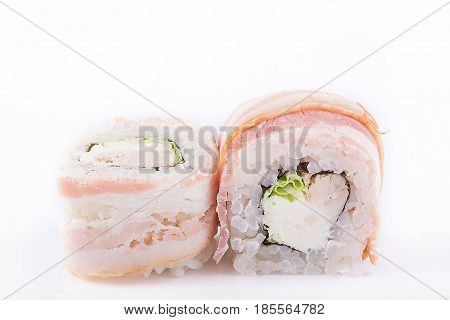 Japanese Cuisine, Sushi Set: Roll With Smoked Breast, Cream Cheese, Chinese Salad And Bacon On A Whi