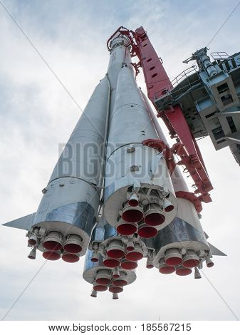 russian space rocket monument from below with red duct